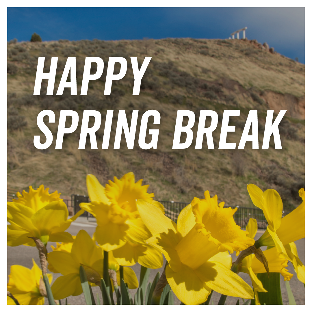 A picture of Red Hill with yellow flowers in the foreground with the text Happy Spring Break