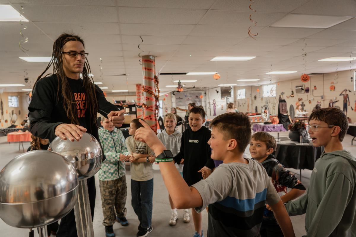 A Haunted Science Lab volunteer prepares to demonstrate the principles of static electricity with a Van de graaff generator