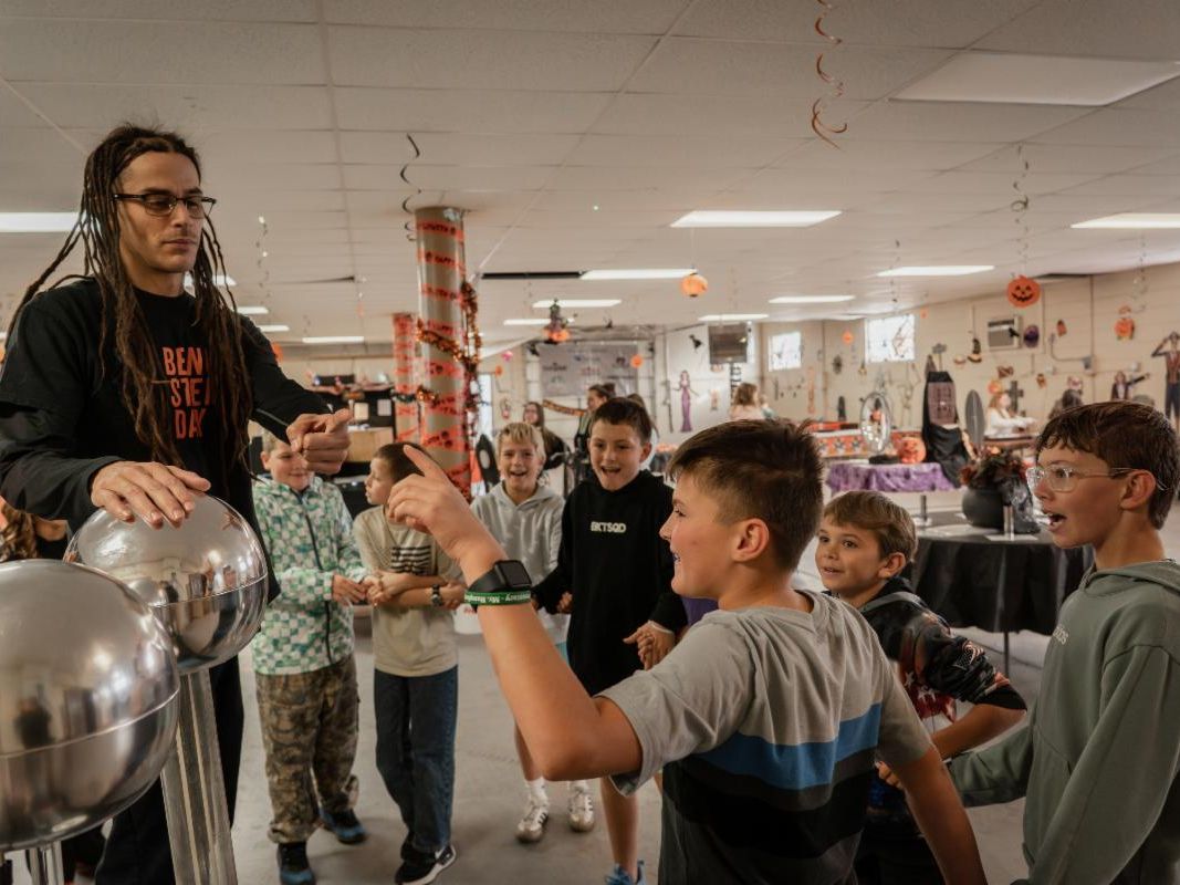 A Haunted Science Lab volunteer prepares to demonstrate the principles of static electricity with a Van de graaff generator