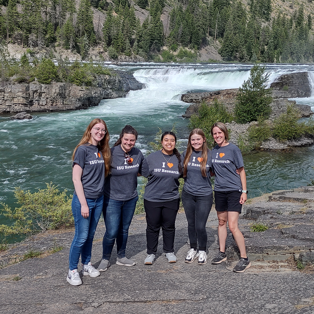 Kinta Serve associate professor at Idaho State University an her students pose for a photo near a river in Montana