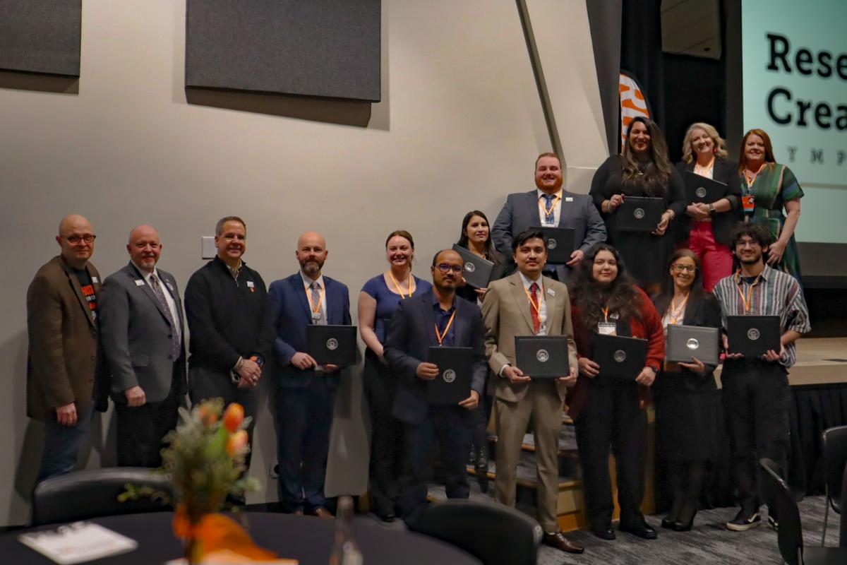 Winners at ISU's Research and Creative Works Symposium pose for a photo.