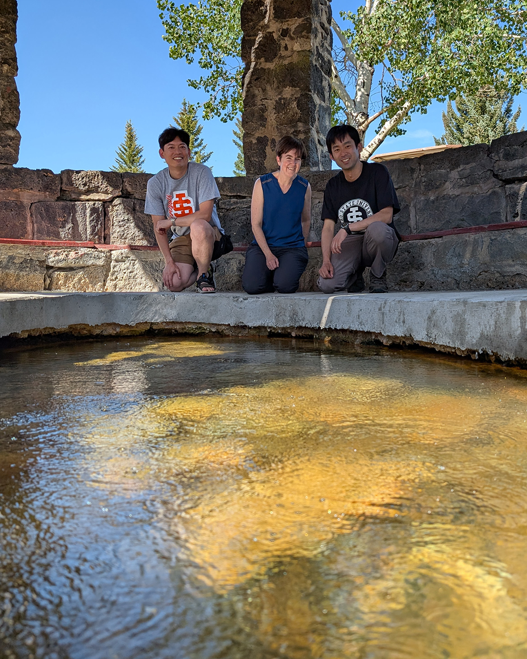 Kenta Iwasaki Sarah Godsey and Shodai Sho Iwagami pose for a photo at Hooper Springs.