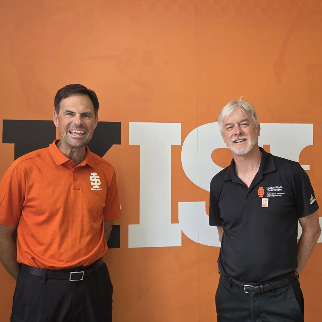 Alex Bolinger and Jim Widmann pose for a photo outside of the KISU studio