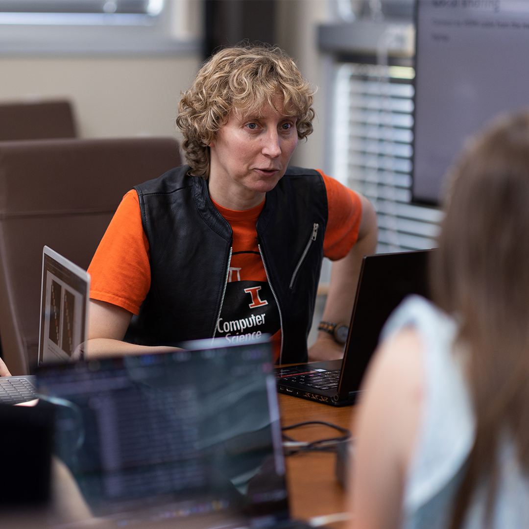 Leslie Kerby, associate professor of computer science, works with students.