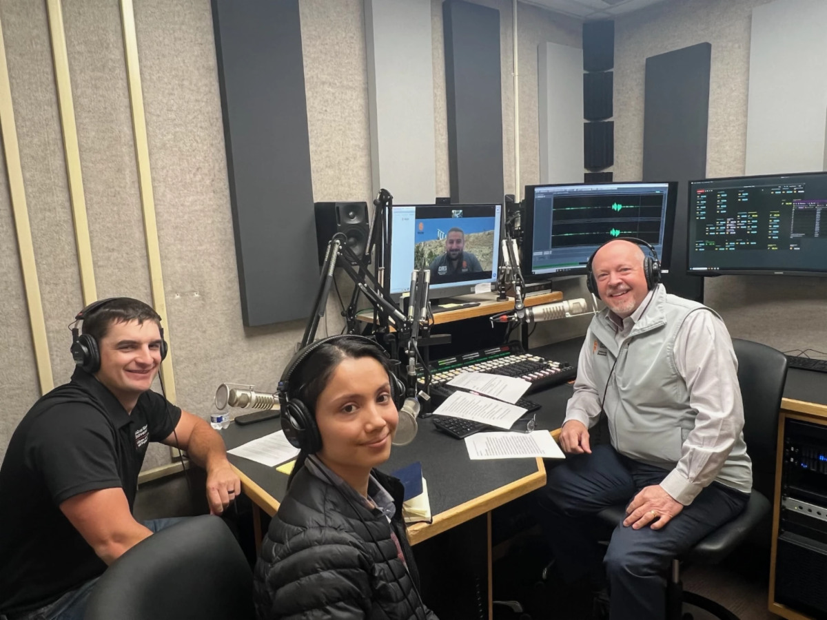 Jared Cantrell Prajita Budhathoki and Marty Blair pose for a photo in the KISU studio