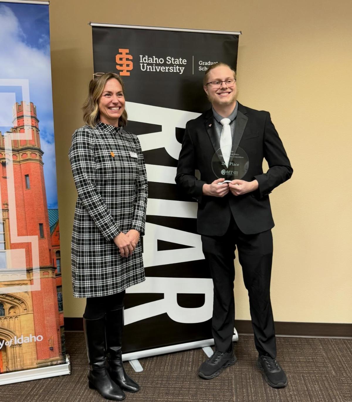 Will Kimball poses for a photo at the statewide 3MT competition with Karen Appleby