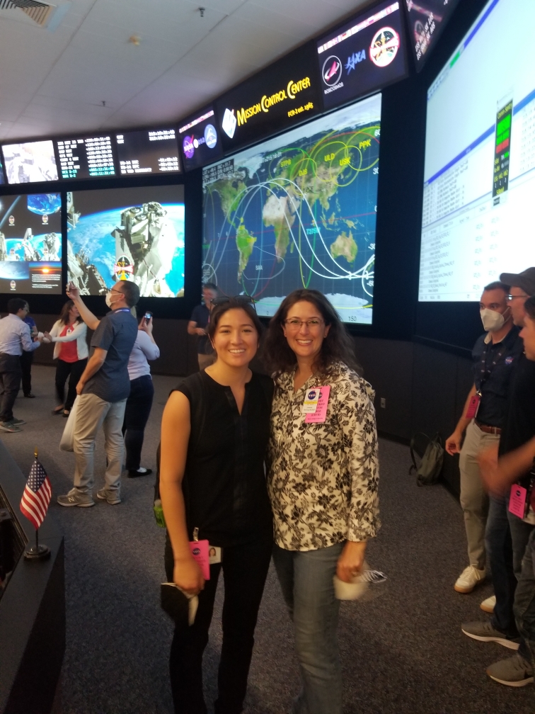 Angela Garcia and Shannon Kobs Nawotniak pose for a photo at Mission Control in Houston.