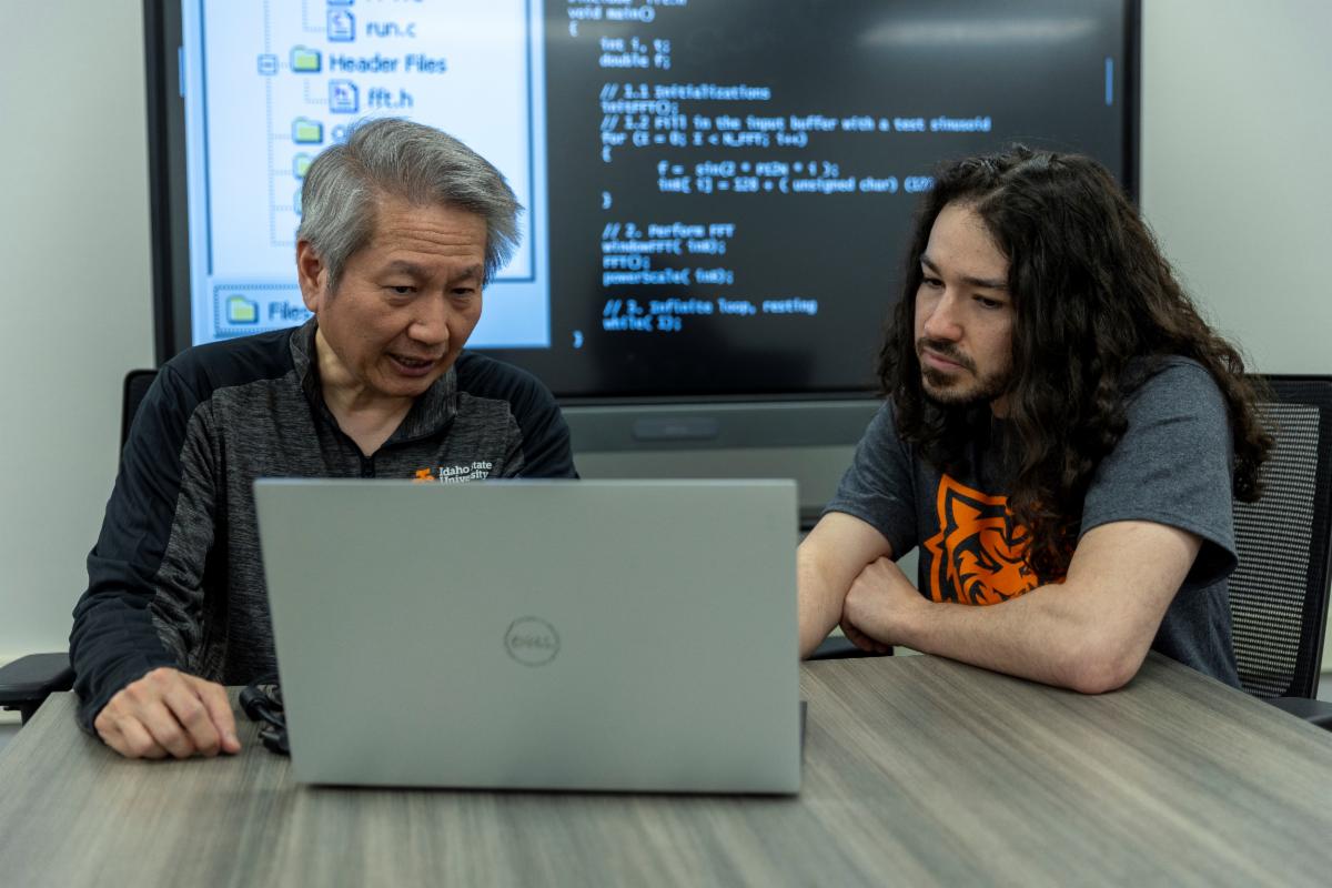Left Steve Chiu professor and chair of the computer science department at ISU and Teo Hanson software engineering student pose for a photo on ISUs Pocatello campus