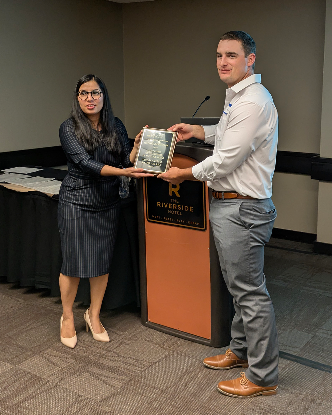 Jared Cantrell receives an award from the ASCE - Southern Idaho Section.