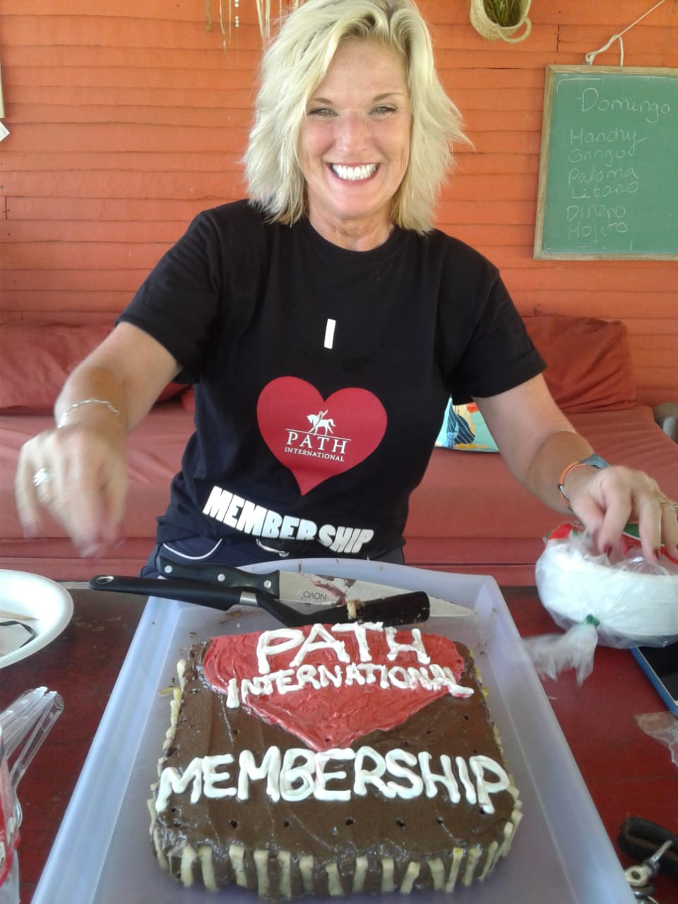 Ruth Claus with PATH Intl. Membership cake