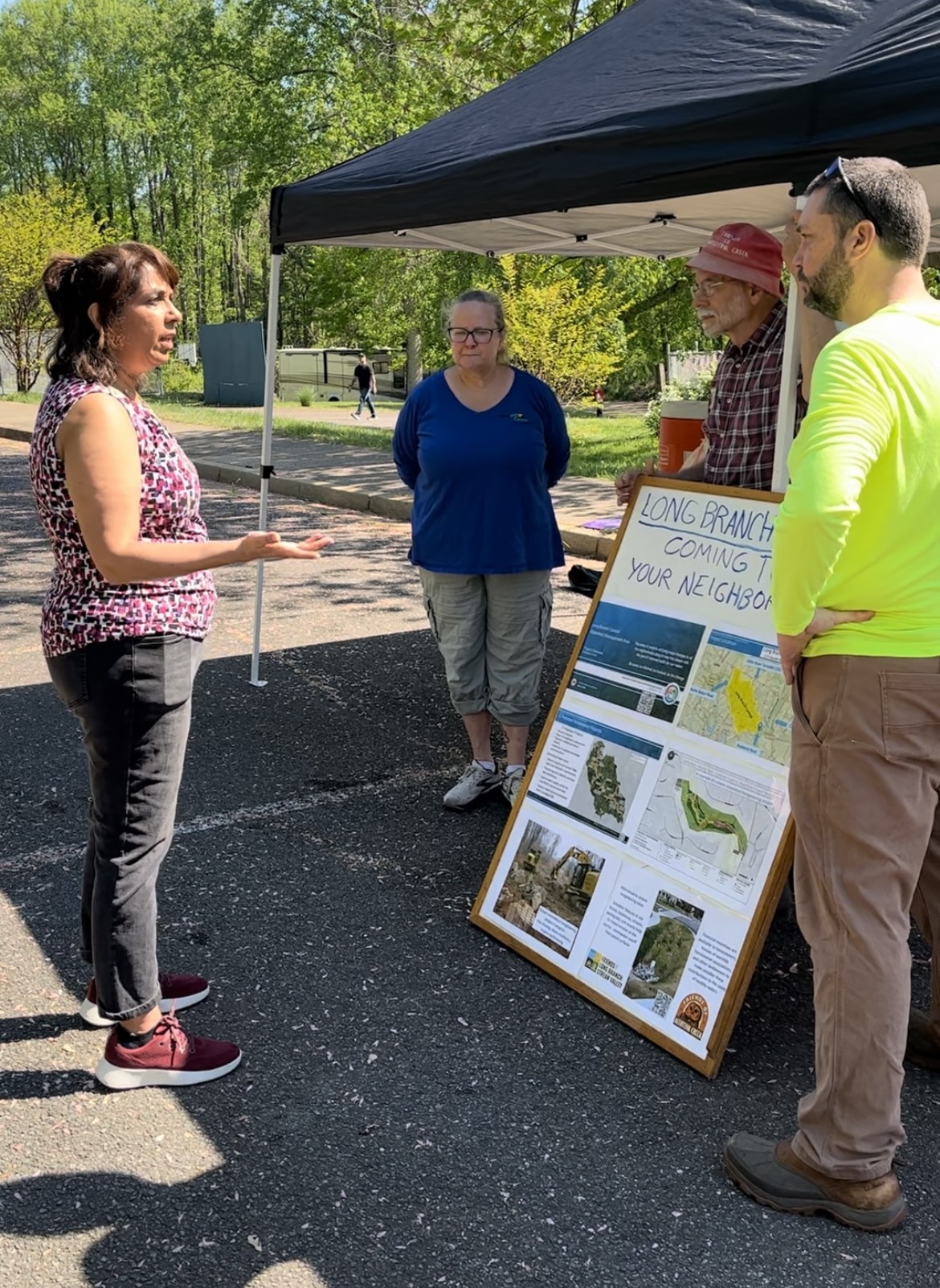 Rachna speaking to organizers of the Long Branch Stream cleanup