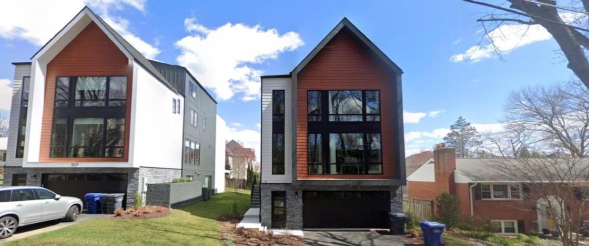 A pair of tall houses that may or may not be in compliance with the Residential Building Height zoning ordinance