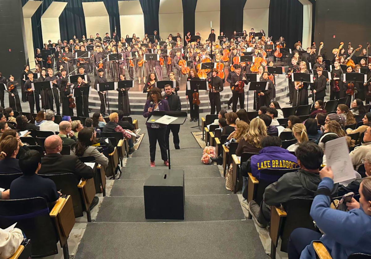 Supervisor Sizemore Heizer congratulates the Lake Braddock Symphony Orchestra