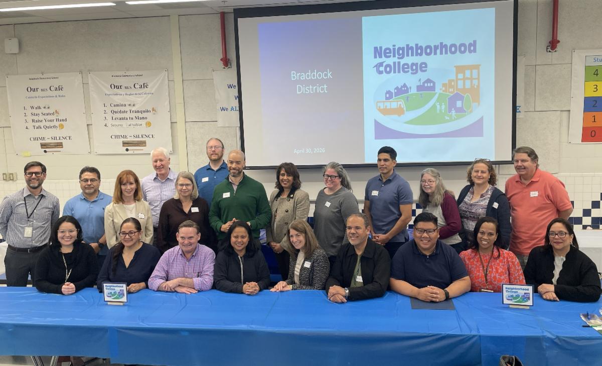 Supervisor Sizemore Heizer poses with graduates of the Neighborhood College program, April 30, 2026
