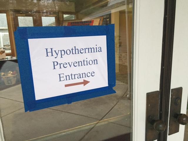 Picture of a door with a sign reading "Hypothermia Prevention Entrance"