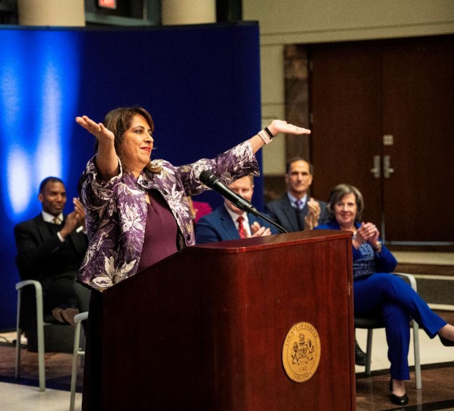 Supervisor Rachna Sizemore Heizer greets the assembled crowd from the podium at her swearing-in ceremony.
