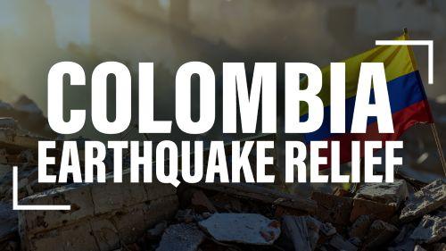 earthquake rubble with Colombian flag