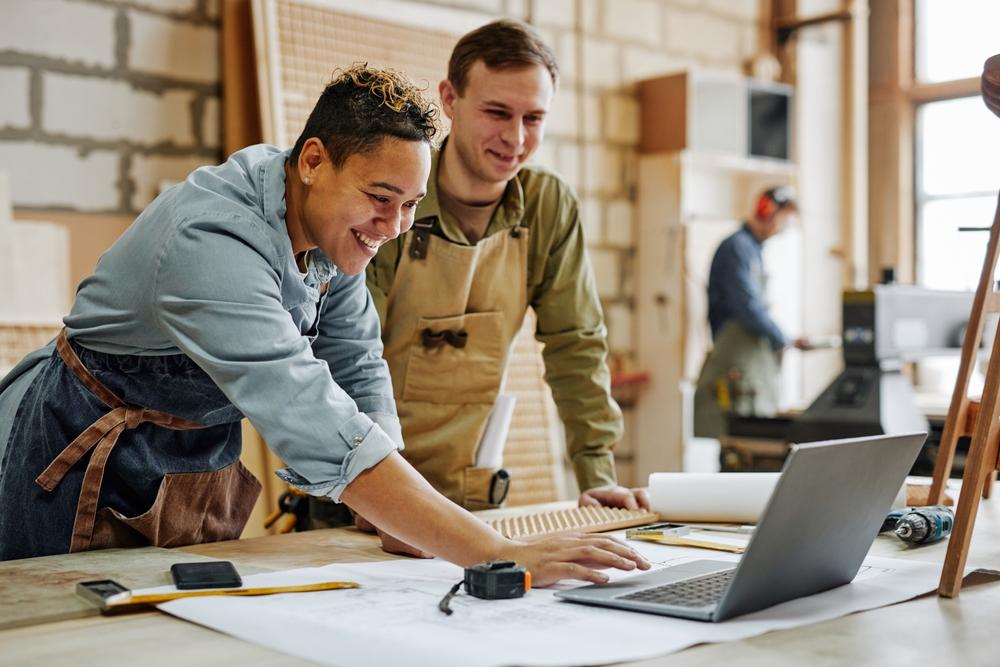 Two colleagues working together on a design project