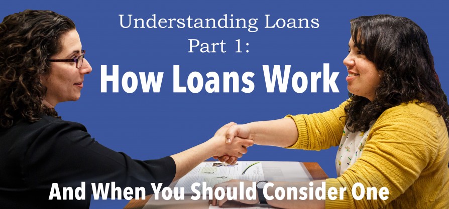 Two women shake hands over a desk.