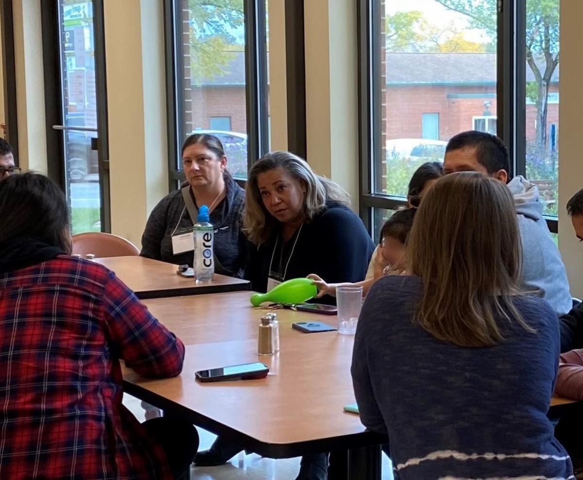 Town hall participants talking with each other