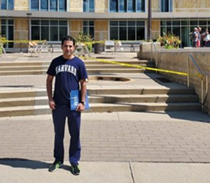 Ahmad in front of Madison College