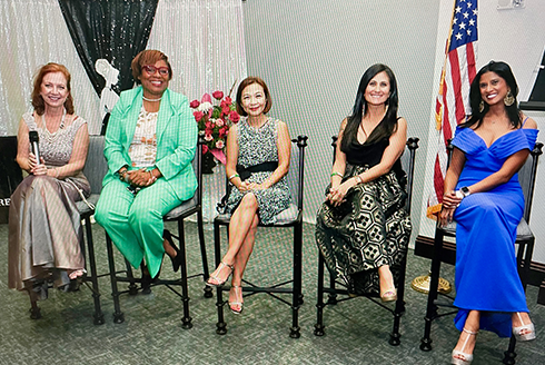Fawn Ngo sits center with other panelists