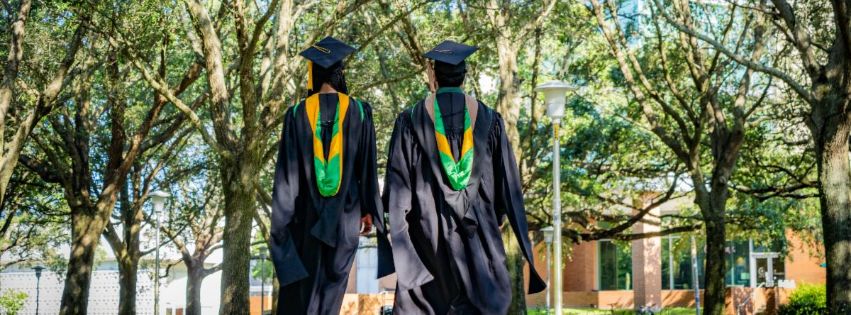 Students walking away with their gap and gown