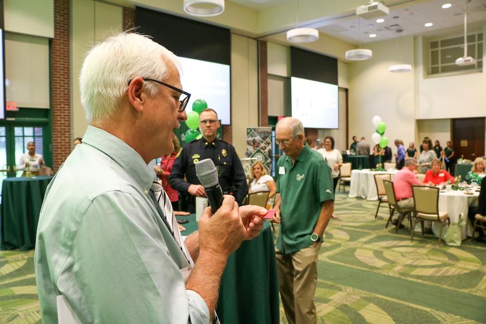 John Cochran calls out raffle ticket numbers