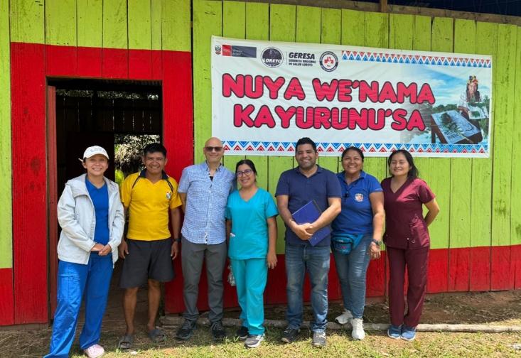 Jerome Galea stands with local health professionals and community members of the Shawi Tribe.