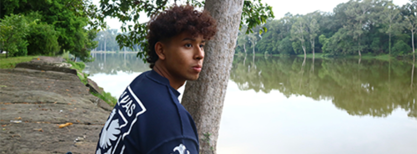 Rithy Rung Rith looking over a body of water
