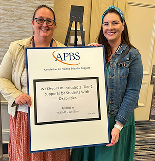 Stephanie Martinez and Lauren Evanovich with poster presentation
