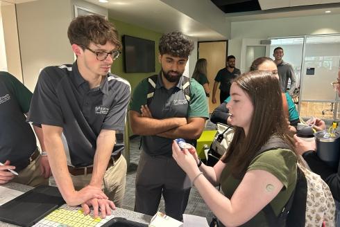 Students collaborating at the IPE event
