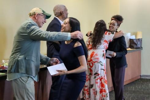 Student hugs their professor