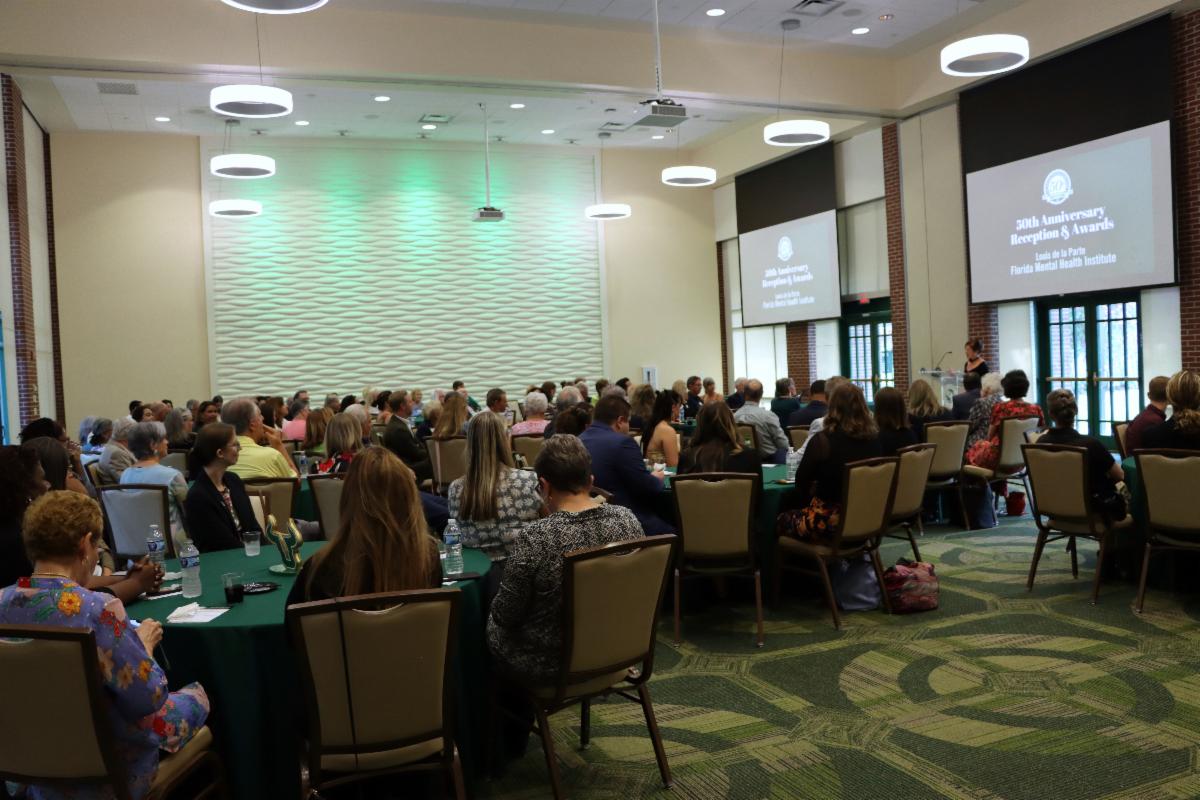 Kathleen Moore speaks to the crowd at the FMHI 50th anniversary celebration