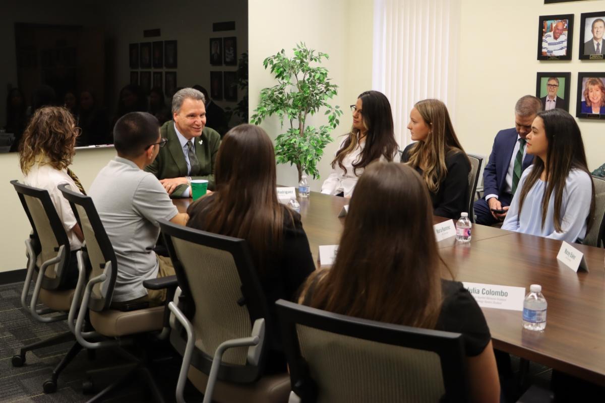 President Limayem speaks with student panel.