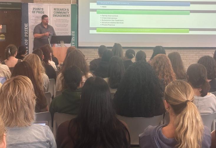 Travis Atchison presenting on social work leadership to Master of Social Work students.