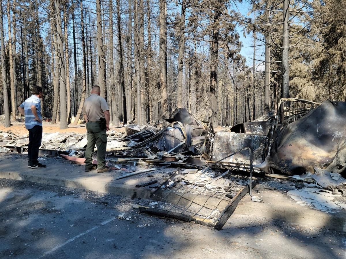 Board Member Gaines and El Dorado County Sheriff Lt Jeff Leikauf inspect what remains of the Grizzly Flats US Post Office after the Caldor Fire swept through