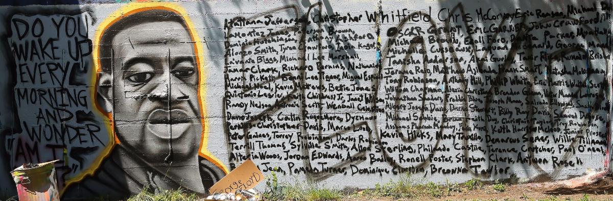 Mural with George Floyd_s face_ names of Black people killed by police brutality_ and the quote _Do you wake up every morning and wonder am I next_