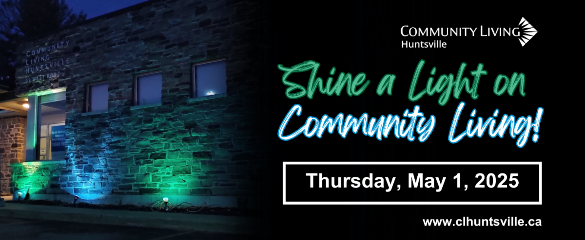 a stone building at night light in blue and green flood lights plus text that reads Shine a Light on Community Living