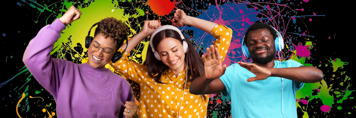 3 smiling people dancing while wearing headphones.