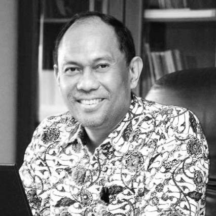 ICANN APAC community member Ashwin Sasongko Sastrosubroto, photographed here in a black and white image while wearing a floral patterned shirt.
