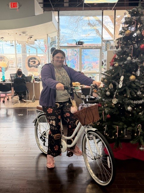 The first place winner of the Ruby Bridges poetry competition with the bike they won. 