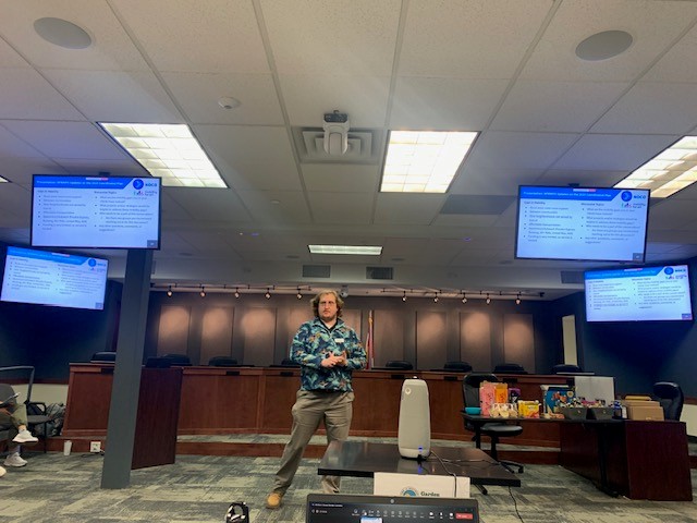 Mobility Planner Aaron Hull giving a presentation on the 2025 Coordinated Plan. 