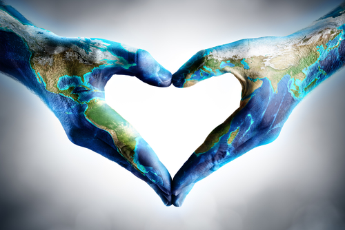 earth s day celebration - hands shaped heart with world map - elements of this image furnished by NASA 