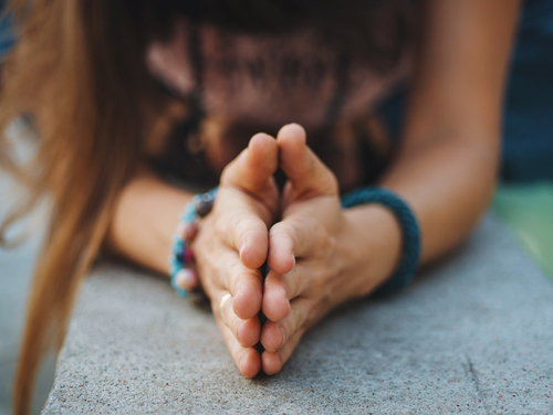 Woman hands together symbolizing prayer and gratitude. Mudra. Yoga concept.