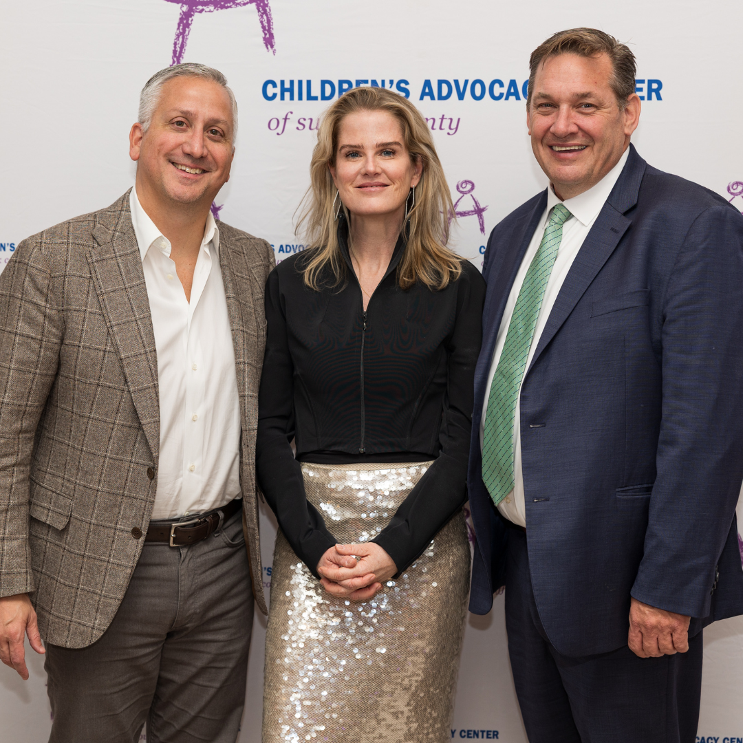 Honorees Jim Quagliaroli Kim Henry Quagliaroli and Liam Lowney in front of the CAC logo backdrop. Photo credit Olivia Cerci