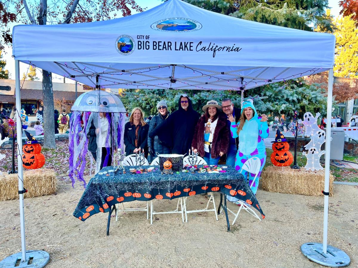 City staff, City Councilmembers and their spouses passing out candy at the City of Big Bear Lake booth