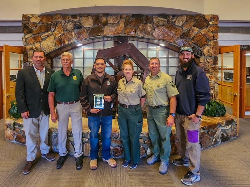Sean Sullivan and Israel Gomez Rosales with representatives from the US Forest Service and Southern California Mountains Foundation