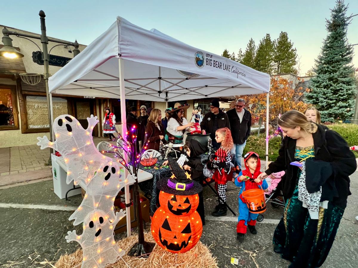 City staff, City Councilmembers and their spouses passing out candy at the City of Big Bear Lake booth