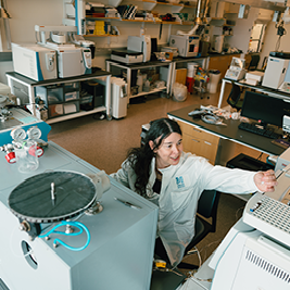 blue red green and yellow confetti falling on green text that says Kuali